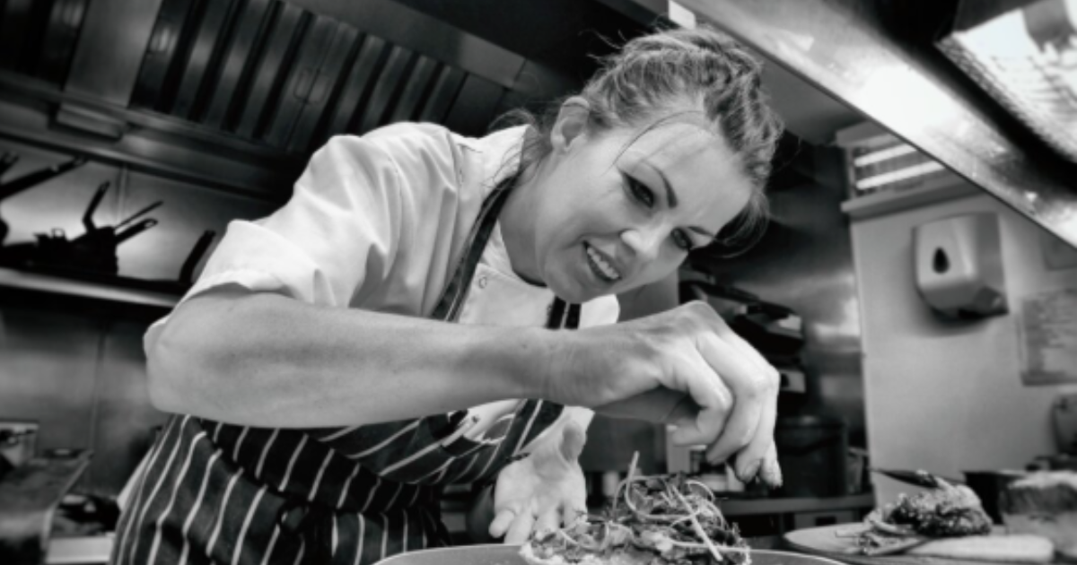 Charlotte Vincent working in a kitchen 
