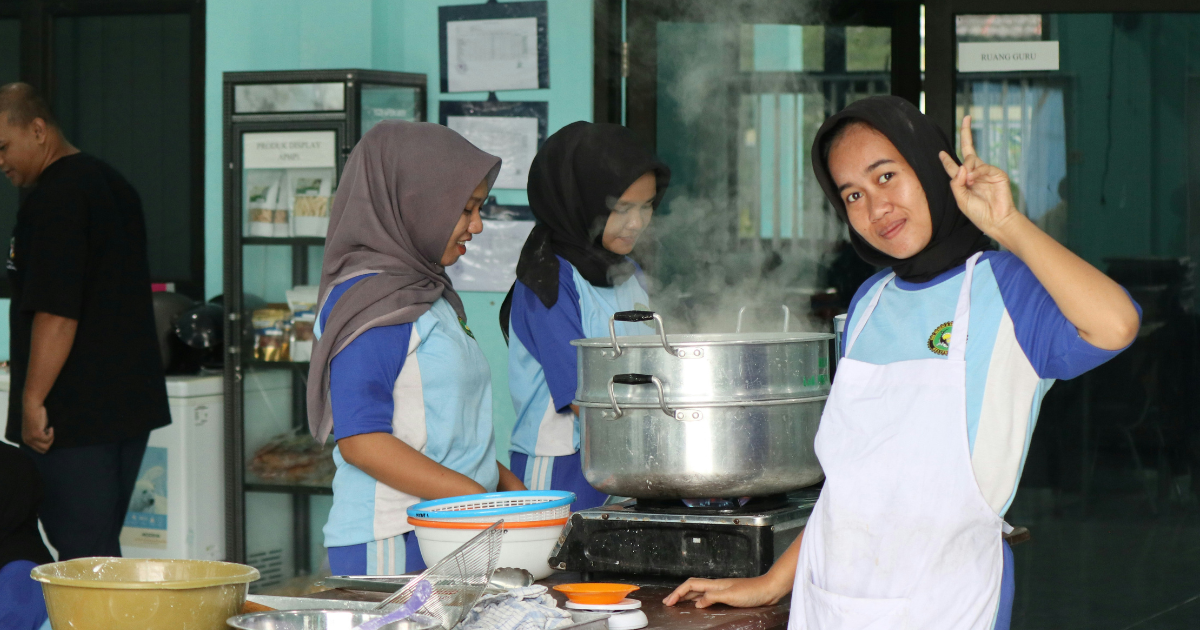 Women chefs working by the stove.