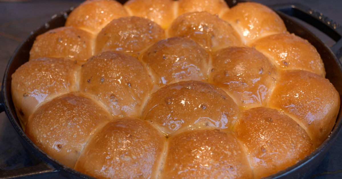 Toasted grain Parker House rolls glazed with grilled heather honey at Restaurant Gordon Ramsay High, London.