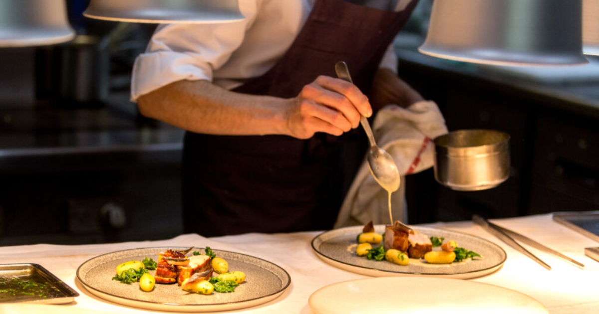 A chef plating up in an Australian kitchen