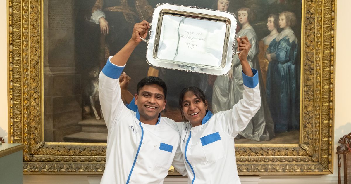 Ashish and Loki with the Bake Off: The Professionals 2026 trophy