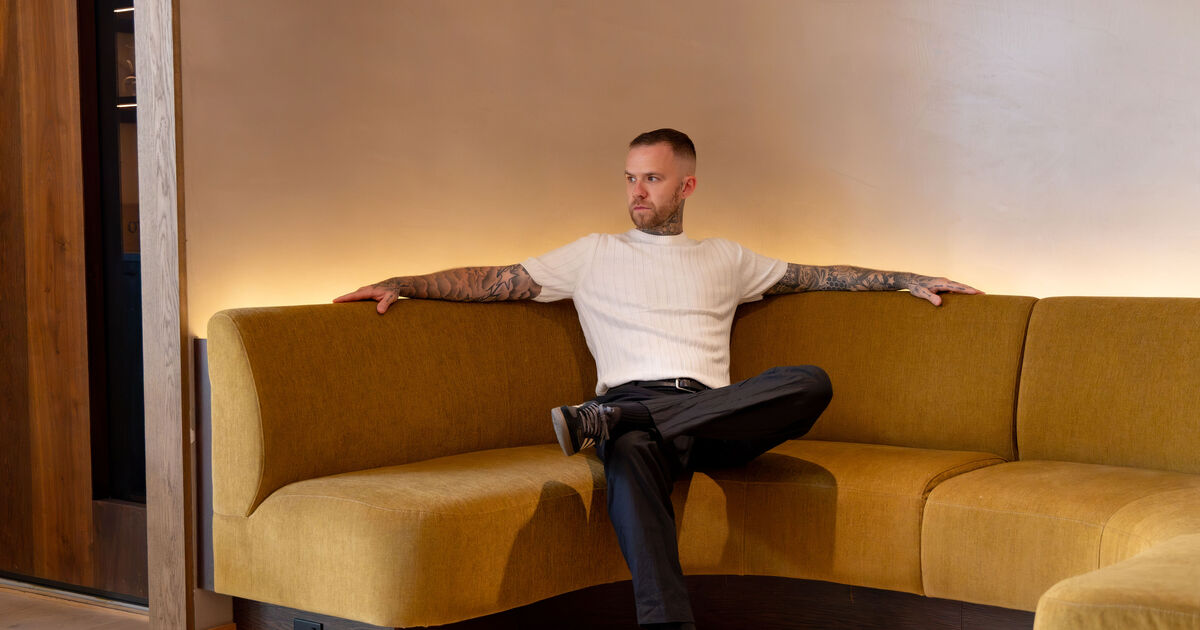 Ben Murphy on a sofa
