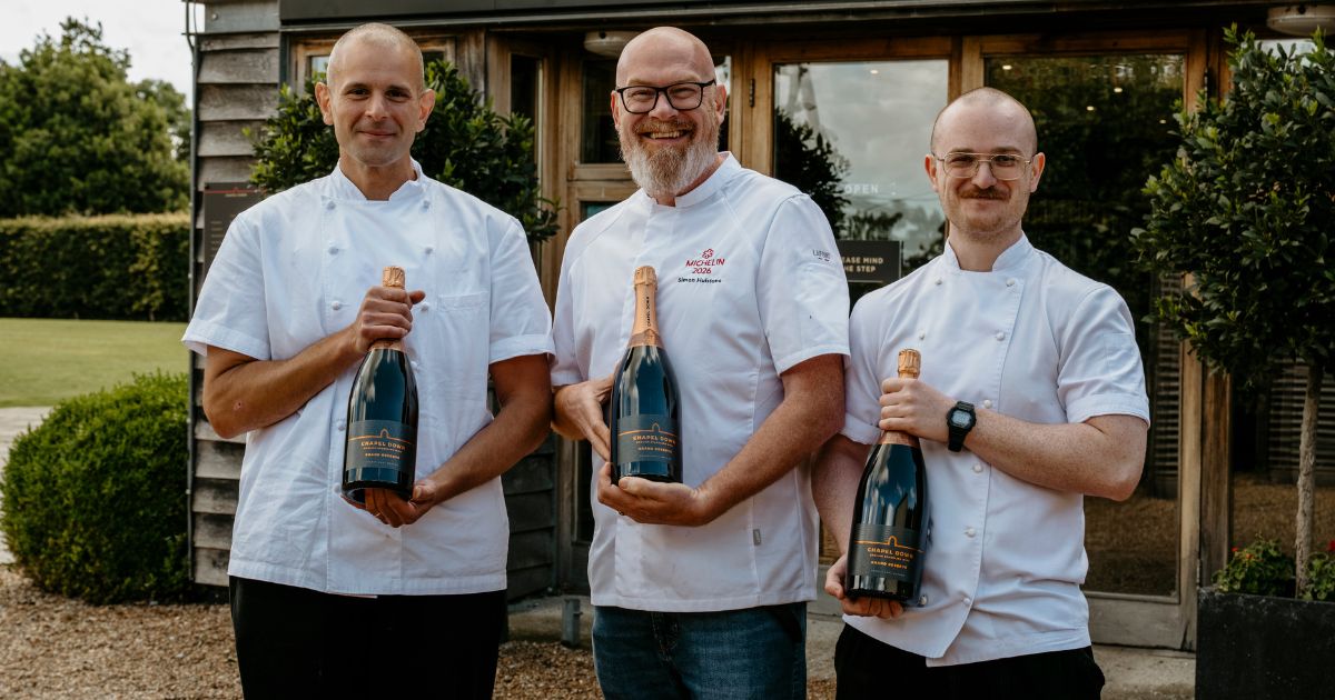 Martin Carabott, Simon Hulstone and Ethan Pack at Chapel Down with bottles of sparkling wine