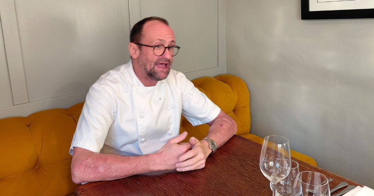 Daniel Smith sitting at a table