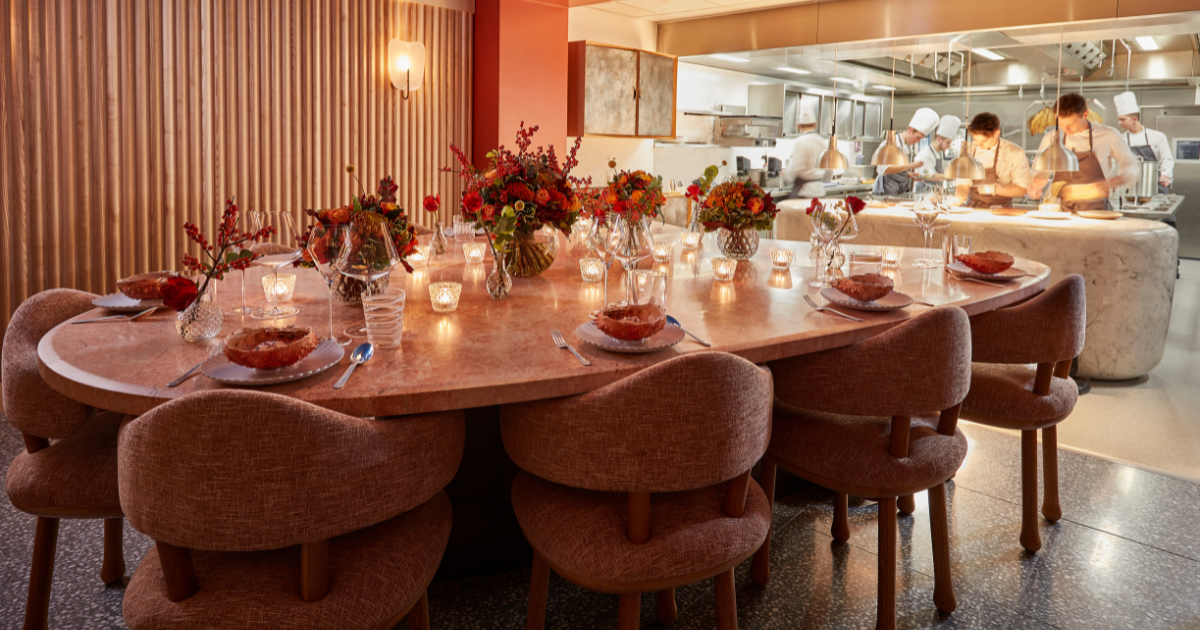The kitchen table at Hélène Darroze at The Connaught, overlooking the open kitchen where guests can watch the chefs at work.
