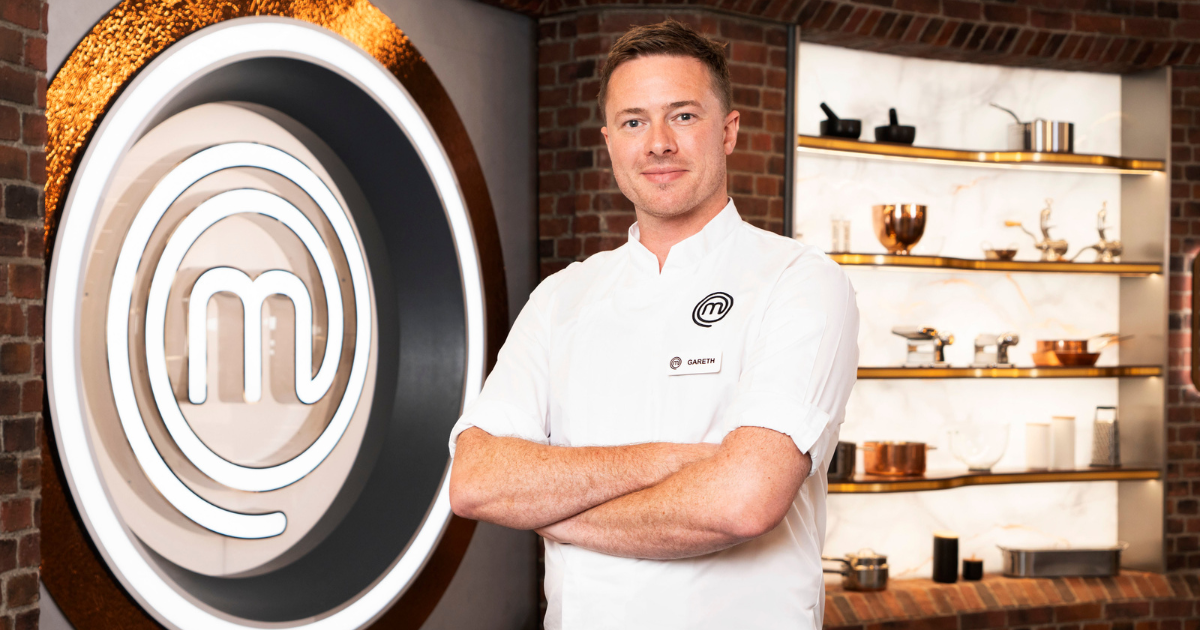 Gareth Baty in front of the MasterChef logo