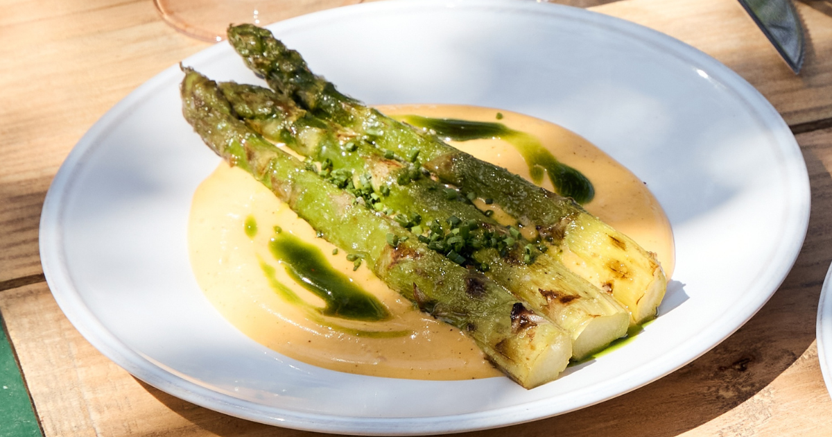 Grilled asparagus, ajo blanco, mustard leaf & black garlic dressing