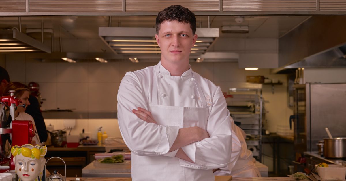 Will Bee in chef whites with arms crossed