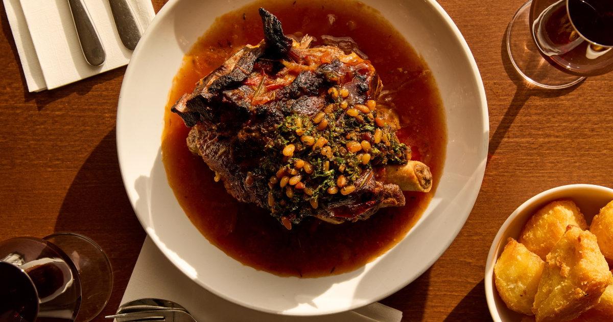 Slow-cooked lamb shoulder with mint and pine nut sauce