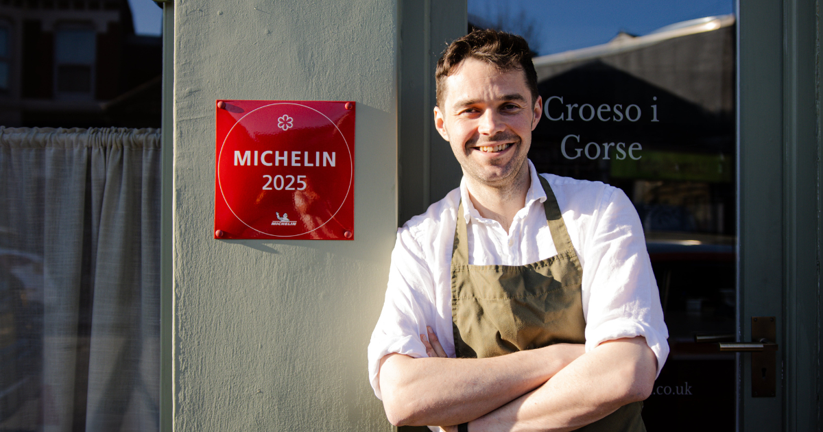 Tom Waters outside Gorse restaurant with Michelin plaque